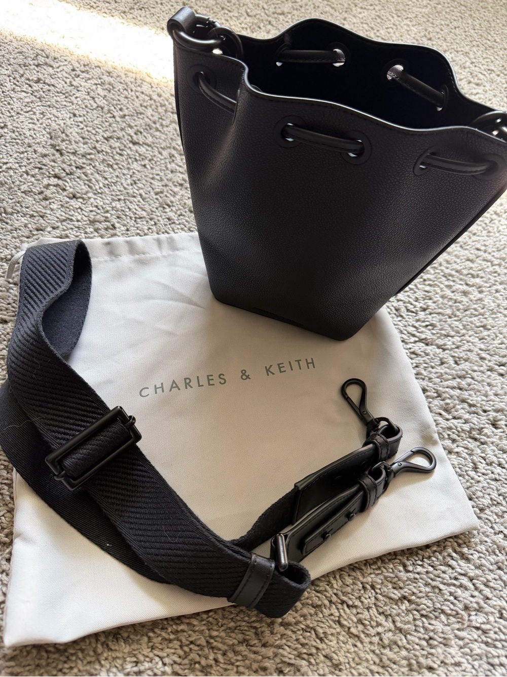 Charles & Keith Black Leather Bucket Bag with Chain Handle and Adjustable Strap